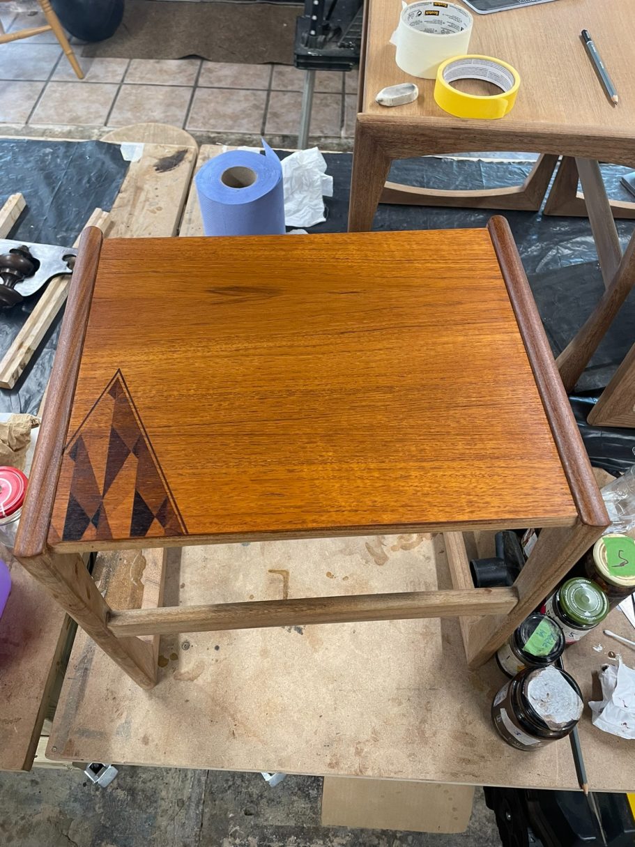 Smallest table finished with the design Wooden table surface with a geometric design and a polished finish.
